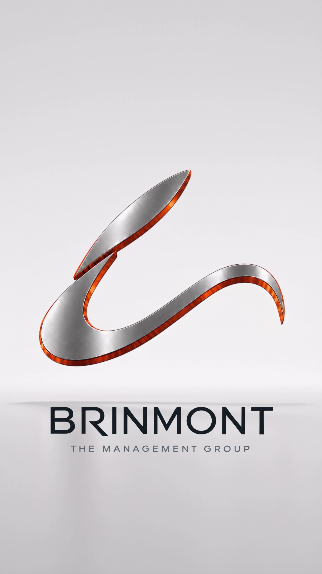Brinmont’s sculpted titanium and orange emblem